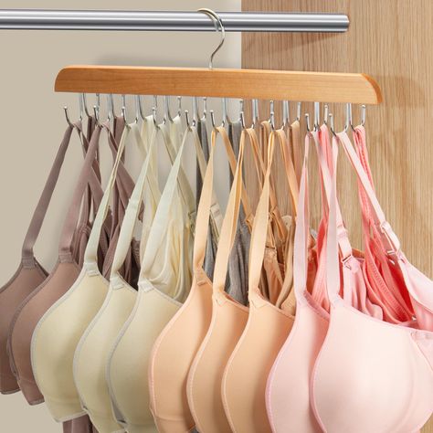 PRICES MAY VARY. Durable Bra Hanger: Crafted with high-quality metal and wood, our hanger ensures long-lasting durability. Experience a reliable storage solution that stands the test of time, providing a clutter-free and efficient closet for years to come. Space Saving Bra Hanger : With 20 foldable hooks, this bra hangers for closet organizer can be fully unfolded for the display of camisoles ,bras, or some other little matching accessories ,fully folded to save your closet space.Say goodbye to Bra Hanging Ideas, Matching Hangers, Tank Top Hanger, Bra Organizer, Bra Hanger, Tank Top Bra, Bra Organization, Bra Storage, Space Saving Hangers