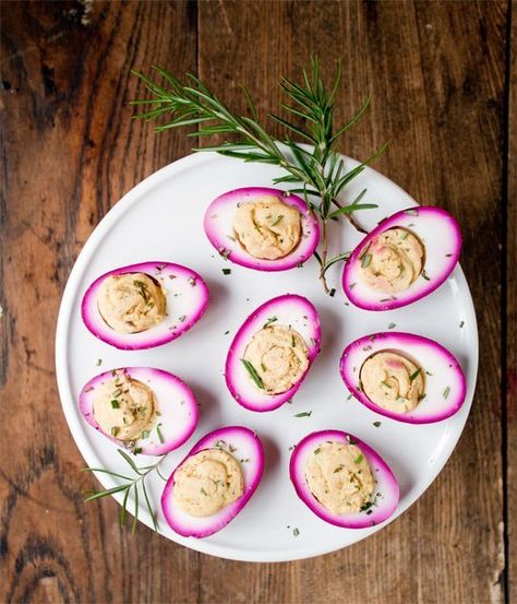 Is there a more beloved party food than a platter of freshly deviled eggs?  The humble and classy appetizer gets sassed up when plunged into a jar of beets, vinegar, brown sugar and pink pepper corns.  This unique twist will turn heads and delight tummies!  More photos below: Pickled Deviled Eggs, Egg Appetizer, Easter Appetizers, Pickled Eggs, Easter Brunch Food, Pickled Beets, Egg Dishes, Food Appetizers, Deviled Egg