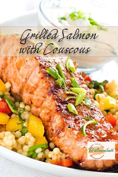 Grilled salmon with couscous is a healthy and flavorful meal that is perfect for a summer night. The salmon is grilled to perfection and the couscous is cooked in a flavorful broth Fish Couscous Recipe, Isreali Coucous With Salmon, Couscous With Salmon, Salmon With Couscous Recipes, Salmon Couscous Bowl, Salmon Couscous Recipes, Salmon And Couscous Recipes, Couscous And Salmon, Couscous Salmon