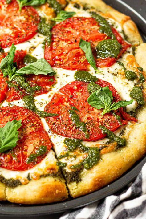 This pesto pizza recipe is better than take out and comes together in less than 20 minutes! Use refrigerated pizza dough from the store or my quick and easy pizza dough recipe along with all those ripe tomatoes and overgrown basil from the garden! Unique Pizza Recipes, Best Pesto, Making Pesto, No Knead Pizza Dough, Nut Free Pesto, Pesto Pizza Recipe, Make Pesto, Recipes With Parmesan Cheese, Dairy Free Pesto