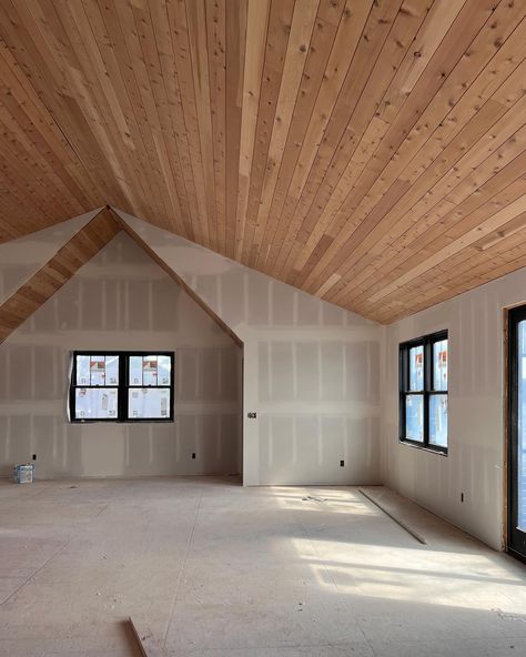 WOOD CEILING TRANSFORMATION. We had big dreams of a beautiful natural wood ceiling in the guest house but when we saw the red/orange ceiling we felt defeated. After considering our options of staining or painting we had a few samples boards made and found the perfect solution. Scroll all the way to the end for photos of the products used to achieve the lighter more natural looking wood. #woodceiling #guesthouses #vaultedceiling #naturalwood #modernrustic #rusticmodern Wood Ceilings Concrete Floors, Vaulted Wood Plank Ceiling Living Room, Wood Paneled Vaulted Ceiling, Wood Ceilings Vaulted, Wood Floors And Ceilings, Vaulted Ceiling Wood Paneling, Wood Slanted Ceiling, Wooden Vaulted Ceiling Living Room, Tongue And Groove Vaulted Ceiling Living Rooms