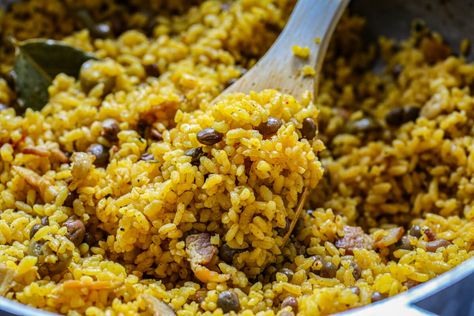 Puerto Rican arroz con gandules | Pigeon pea and rice recipe Puerto Rican Rice And Gandules, Puerto Rican Arroz Con Gandules, Rice And Pigeon Peas Recipe, Cuban Pernil Recipe, Arroz Con Gandules Puerto Rican Recipe, Arroz Con Gandules Puerto Rican, Pigeon Peas Recipe, Arroz Con Gandules Recipe, Rice With Pigeon Peas