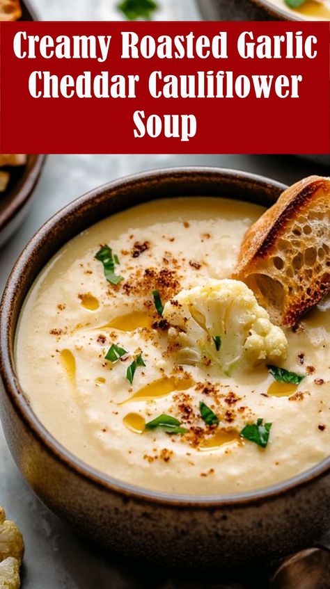 This smooth, Creamy Roasted Garlic Cheddar Cauliflower Soup is absolutely what you want on a chilly day. Cheddar Cauliflower Soup, Roasted Garlic Soup, Cauliflower Recipes Soup, Creamy Cauliflower Soup Recipes, Cauliflower Garlic Soup, Roasted Garlic And Cauliflower Soup, Cheddar Cauliflower And Garlic Soup, Roasted Cheddar Cauliflower Soup, Roasted Cauliflower Cheddar Soup