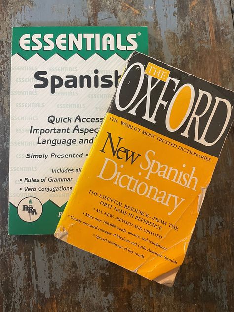 "This Learn Spanish Book Set includes 2 soft cover books: - The Oxford New Spanish Dictionary. This is the essential resource with more than 100,000 words, phrases, and translations with a greatly increased coverage of Mexican and Latin American Spanish and a quick reference chart and pronunciation guide.\" (Book cover shows significant wear & tear and pages show aging.) - Essentials of Spanish. Research & Education Association. Ricardo Gutierrez Mouat. \"This volume is a comprehensive and conci Spanish Dictionary Aesthetic, Spanish A Level, Spanish Books Aesthetic, Studying Spanish Aesthetic, Spanish Language Aesthetic, Learning Spanish Aesthetic, Polyglot Aesthetic, Language Learning Spanish, 2025 Manifestation