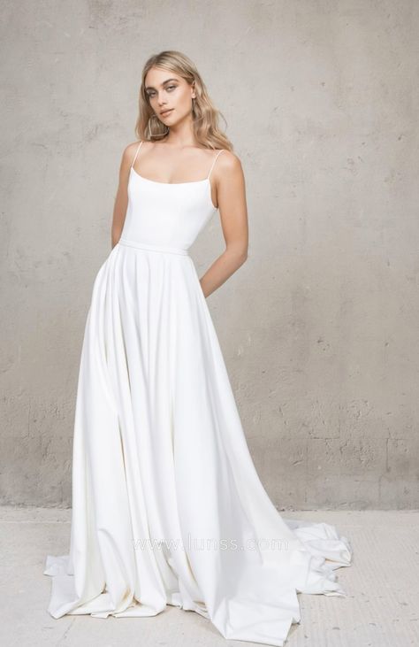 Featuring a scoop neckline with spaghetti straps extending to the low back, this casual ivory satin A-line long summer beach wedding dress is an ideal choice for a minimalist bride. Beach Wedding Dress Elegant, Simple And Elegant Wedding Dress, Simple Spaghetti Strap Wedding Dress, Simple Aline Wedding Dress, Spagetti Strap Wedding Dress, Comfy Wedding Dress, Minimalist Wedding Dress Elegant, Scoop Neck Wedding Dress, Vagabond Bridal