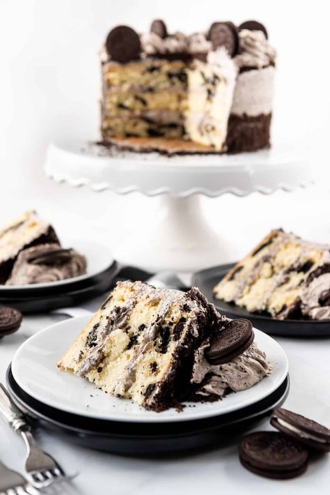 This Cookies & Cream Cake is a show-stopper with moist, fluffy white cake layers studded with large chunks of whole Oreo cookies, then frosted with the best Oreo buttercream frosting! It's the perfect celebration cake for anyone who loves milk's favorite cookie! #Oreos #cookiesandcream #cake #best #homemade #fromscratch #frosting #buttercream #dessert Oreo Cake Recipe Homemade, Cookies N Cream Cake Recipe, Oreo Buttercream Frosting, Fluffy White Cake, Cookies Cream Cake, Frosting Buttercream, Oreo Buttercream, Vegetarian Cookies, Cookies And Cream Cake