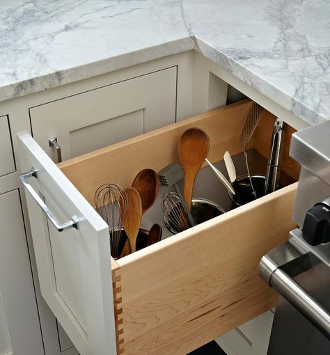 Beside a stainless steel stove, a white shaker cabinet finished with a polished nickel pull pulls out to reveal a utensils drawer fitted with three built in polished nickel cups perfect for both large and small kitchen utensils. Under Cabinet Utensil Storage, Under Stove Storage, Utensil Storage Drawer, Utensils Drawer, Kitchen Utensil Drawer, White Shaker Cabinet, Kitchen Utensil Rack, Light Pewter, Kitchen Utensil Storage