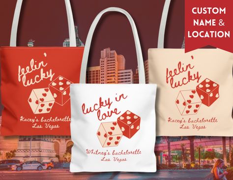 "Hey there, bride tribe! Get ready to hit the jackpot with our custom matching bachelorette tote bags - they're the perfect accessory for your Vegas adventure! For our leading lady, we've got the ultimate tote bag featuring \"Lucky in Love.\" It's the perfect way for the bride to stand out while carrying all her bachelorette essentials. And check this out: We've added her name and a spot for a custom location, making each tote extra special. Plus, there are two dice with hearts for eyes, adding a playful Vegas touch! But wait, the luck doesn't stop there! For the rest of us lucky ladies, our tote bags also say \"Feelin' Lucky,\" along with the bride's name and a spot for a custom location. It's a sweet reminder of our unforgettable Vegas getaway and our love for the bride-to-be. Whether yo Vegas Bachelorette Gift Bags, Vegas Goodie Bags, Las Vegas Gift Ideas, Dice With Hearts, Lucky In Love Bachelorette Party, Vegas Bachelorette Gifts, Bachelorette Essentials, Vegas Bachelorette Party Favors, Bachelorette Locations