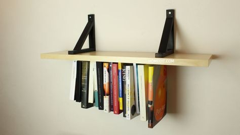 Double up on your display space with this unusual upside-down shelf. Start with a wooden board and a length of elastic. Reading Loft, Area Fashion, Hanging Bookshelves, Diy Dorm, Diy Bookshelf, Cottage Kitchen Design, Bookshelf Ideas, Diy Regal, Dorm Diy