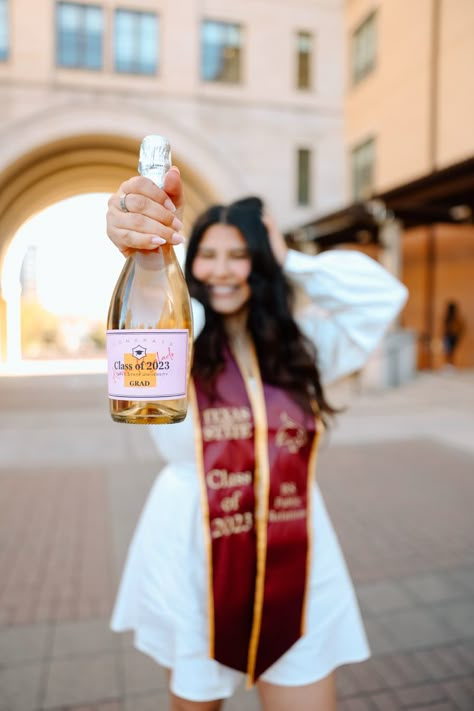 Tassel Graduation Pictures, Grad Photos With Champagne, College Graduation Champagne Bottle, College Grad Photoshoot Champagne, Grad Champagne Pic, Pink Graduation Cap And Gown Pictures, Grad Photos Champagne, College Graduation Pictures Masters, Graduation Pictures With Champagne