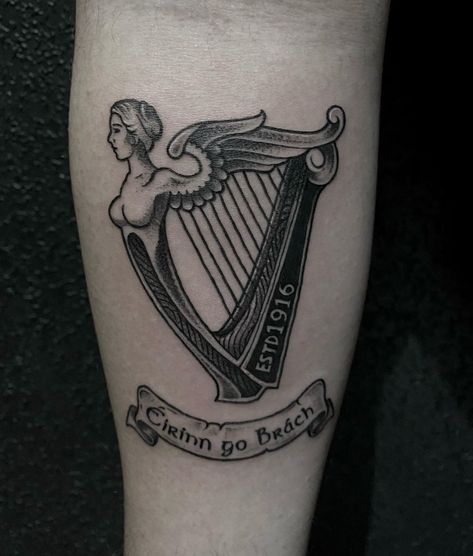 Depiction of an isish harp design. American Traditional Harp Tattoo, Northern Ireland Tattoo, Irish Traditional Tattoo, Guinness Harp Tattoo, Irish Mythology Tattoo, Traditional Irish Tattoos, Celtic Harp Tattoo, Irish Heritage Tattoo, Guinness Tattoo