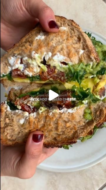 Healthy Eating on Instagram: "Video 🎥 by @healthfulradiance 

i think this sandwich may give all my other ones a run for their money… but someone should make them all just to confirm 😚 

consider this your weekly reminder that carbs are your friend 🙏 we’re all about balanced eats over here :)

sun-dried tomato avocado grilled cheese

toast two slices of sourdough to your liking, then spread/layer on the following:

- cream cheese (i used vegan)
- sun-dried tomato pieces 
- two slices of cheese (i used vegan provolone)
- arugula
- mashed avocado

sandwich the pieces together, brush both sides with butter or oil of choice, cook on the stovetop for 2-3 min on each side or until crispy and the cheese has melted. slice and enjoy!" Tomato Avocado Grilled Cheese, Avocado Grilled Cheese, Weekly Reminder, Tomato Avocado, Avocado Sandwich, Pasti Sani, Idee Pasto, Healthy Food Dishes, Cheese Toast