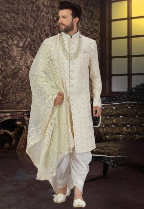 <ul><li> Art Silk Sherwani in Cream</li><li> This Readymade attire is Enhanced with Buttons, Thread and Zari Work and is Crafted in Chinese Collar Neck and Full Sleeve</li><li> Available with an Art Silk Dhoti Pant in Off White and a Net Dupatta in Pastel Green</li><li> Do note: Kanthimala and Footwear shown in the image is for presentation purposes only. Half to one inch may vary in measurement. (Slight variation in actual color vs. image is possible)</li></ul> Sherwani Dhoti For Men, Sherwani With Dhoti Indian Groom, Groom Dhoti Wedding, Dhoti Sherwani Wedding For Men, Sherwani Dupatta For Men, Dulha Dresses For Men, Off White Sherwani Grooms, Dhoti Kurta For Men, Dhoti Sherwani