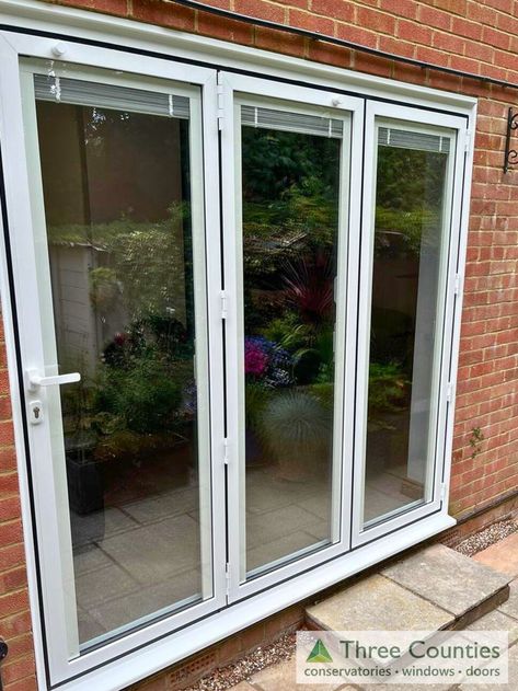 We've just completed the installation of these stunning white aluminium bifold doors in Bagshot. They feature sleek, modern integral blinds that offer effortless operation and enhanced privacy. A perfect blend of style and functionality for any home! #HomeImprovement #BifoldDoors #ModernLiving Integral Blinds, Aluminium Bifold Doors, Bifold Doors, Modern Living, Blinds, Doors, Home Improvement, Sleek, White