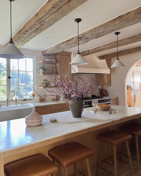 Our kitchen island is roughly 3’ x 9’, and I love how the size can handle an oversized vase full of branches. The big vintage vessel feels so grand in the middle of the long countertop, and I get such joy in refreshing her flowers through the seasons. #kitchen #interiors #interiordesign #dreamkitchen #woodbeams #kitchenisland Double Archway Kitchen, Large Eat At Kitchen Island, Archway Kitchen, Oversized Island Kitchen, Kitchen Long Island, Oversized Vase, Oversized Island, Vintage Vessel, Kitchen With Large Island