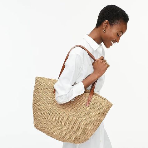 If you want stylish beach bags, look no further than J.Crew, a veritable reader favorite! This reliable brand’s elegant woven straw handbags have a wide opening and roomy interior to fit anything from a beach towel and flip flops to finds at a local seaside market. Take a look on our list and choose your favorite beach bag tote style! #TravelFashionGirl #TravelFashion #TravelAccessories #beachvacation #packingtips #beachbags Vacation Tote Bag, Straw Beach Tote, Best Beach Bag, Travel Fashion Girl, Straw Beach Bag, Straw Tote Bag, Straw Handbags, Straw Tote, Bags Aesthetic