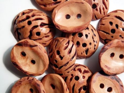 I am SO happy with these buttons hewn from peach pits, which since 2005 have been sitting patiently in a little box waiting for me to figure... Peach Pit, Dorset Buttons, Handmade Buttons, Diy Buttons, Antique Buttons, Button Art, Wooden Buttons, Button Crafts, Nature Crafts