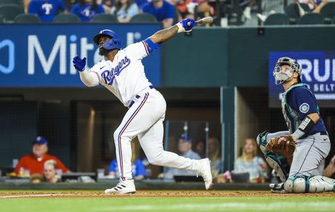 Adolis Garcia belted a three-run home run in the fourth inning, and right-hander Glenn Otto yielded two runs in five Adolis Garcia, Corey Seager, Texas Rangers Baseball, Rangers Baseball, Third Base, Sport Art, Home Run, Seattle Mariners, Baseball Team