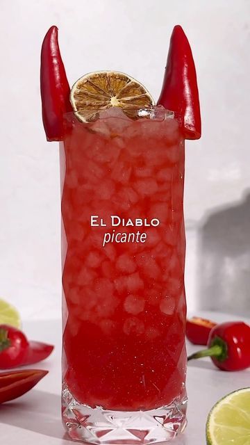 Kelly Pettit on Instagram: "El Diablo Picante 🌶️❤️‍🔥 sweet, spicy, spooky, and super simple 👌🏼 1 1/2 oz reposado tequila 1/2 oz creme de cassis 3/4 oz lime juice 2 slices Fresno chile pepper Ginger beer Red edible glitter (optional) Method: add tequila and Fresno chile peppers to a cocktail shaker and muddle. Add in lime juice, crème de cassis, and red edible glitter (optional). Add ice and shake. Double strain into a highball glass over ice and top with ginger beer. Garnish with Fresno Chile pepper devil horns and a dehydrated lime wheel. Enjoy! #cocktails #cocktail #cocktailidea #cocktailideas #cocktailrecipe #cocktailrecipes #halloween #halloweendrinks #halloweencocktails #halloweenvibes #tequila #tequilacocktails" Easy Halloween Cocktails, Cocktail Theme, Halloween Drink, Red Cocktails, Devil Horns, Reposado Tequila, Chile Pepper, Halloween Cocktails, Fall Cocktails