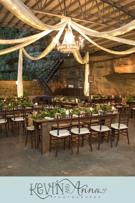 Dark Wooden Farm Tables at a wedding reception in a forest in a cave with lit drapery and a crystal chandelier at Lost River Cave in Bowling Green Kentucky. See more photos by Kentucky Wedding Photographers Kevin and Anna Photography at www.kevinandannaweddings.com Cave Wedding, Kentucky Wedding Venues, Bowling Green Kentucky, Getting Married Abroad, Lost River, Bowling Green Ky, Edible Wedding Favors, Kentucky Wedding, Cave In