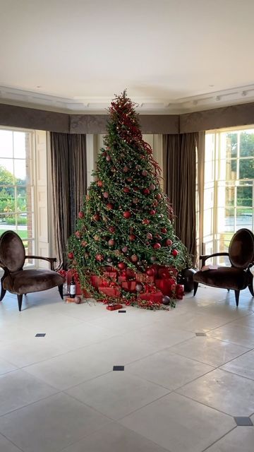 David Lawson Design on Instagram: "Nothing says Christmas like red. A classically decorated 10ft tree draped with swirling ivy to give it a sense of movement. We used real ivy cut from the garden for this look but could absolutely be recreated with high quantity faux stems. If you give it a go let me know! 
-
#christmastree #christmas #holidaydecor #christmasdecor" Faux Stems, Red A, Felt Christmas Ornaments, Santa Ornaments, Holiday Home Decor, Diy Christmas Ornaments, Ornaments Diy, Christmas Tree Ornaments, The Garden