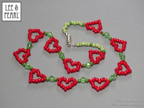 Happy Valentine's Day from Lee & Pearl! Here's a sweet treat for you and your dolls — a FREE tweak-the-pattern packet of diagrams and directions to make a HEART SHAPED DAISY CHAIN CHOKER for dolls or people. Download yours today! Heart Bead Bracelet Pattern, How To Make Beaded Heart, Heart Beads Pattern, Bead Heart Pattern, Heart Seed Bead Bracelets, Heart Bead Tutorial, Seed Bead Heart, Beaded Heart Pattern, Valentines Day Beaded Jewelry