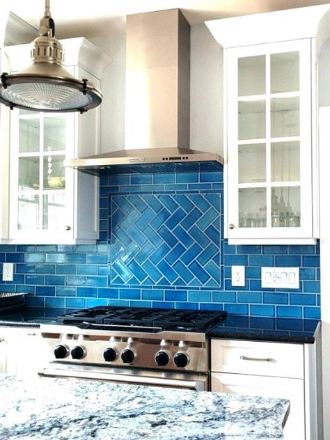 Coordinating color choices like a sky-blue & pearl-white cabinets create the illusion of a bigger space for this contemporary kitchen remodel.  Combined with stainless steel appliances and plenty of natural light, this kitchen is "picture-perfect."  Give our team a call at 541-554-6974 to get your options. Blue Backsplash Kitchen, Herringbone Tile Backsplash, Farmhouse Backsplash, Blue Kitchen Decor, Blue Backsplash, Herringbone Backsplash, Kitchen Glass, Glass Tile Backsplash, Colorful Kitchen