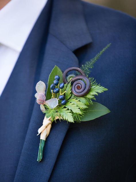 Choose from different types of greenery, berries or fiddlehead ferns for a unique, botanical boutonniere as an alternative to the traditional florals. Fern Fiddlehead, Boutonniere Alternative, Whimsical Woodland Wedding, Boutonniere Ideas, Succulent Boutonniere, Fern Wedding, Feather Flowers, Groomsmen Boutonniere, Whimsical Woodland