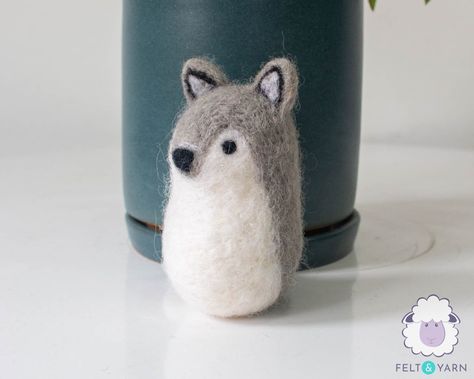 Something about gray wolf is adorable. Why don't you involve him in your pack? Wolves are very loyal and intelligent This needle felted miniature animal can be used as decor, garlands, educational purposes, and a perfect gift for your astrology savvy friends. FEATURES: ☆ Size: 8cm length ☆ Colours: #46 base with #18 designs.  ☆ 100% Pure Wool/Felt from New Zealand ☆ Handmade and customizable ☆ Eco-Friendly ☆ Made using felting/needling technique ☆ Azo-free dyes CARE INSTRUCTIONS: ☆ Shake well to Wolf Characteristics, Felt Wolf, Felted Wolf, Wolf Ornament, Animal Nursery Theme, Gray Wolf, Felted Animals, Miniature Animals, Kids Ornaments