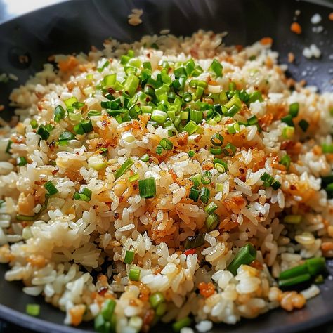 🍚 Enjoy the aromatic and flavorful Sinangag! 🧄✨ #GarlicFriedRice #FilipinoComfort Sinangag (Filipino Garlic Fried Rice) Ingredients: Cooked rice (4 cups) Garlic, minced (6 cloves) Oil (2 tbsp) Salt to taste Green onions, chopped (for garnish) Instructions: Heat oil in a pan over medium heat. Add minced garlic and sauté until golden brown. Add cooked rice and stir-fry until heated through. Season with salt to taste. Garnish with chopped green onions before serving. 🌟 Simple yet flavorful, ... Filipino Garlic Fried Rice, Fried Rice Ingredients, Garlic Fried Rice, Instagram Recipes, Cooked Rice, Rice Ingredients, Trending Recipes, Green Onions, Golden Brown