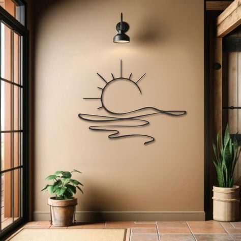 PRICES MAY VARY. STYLISH DESIGN: This beautiful metal wall art was created by processing the perfect sunset view into 2 mm thick metal with wonderfully elegant workmanship. INDOOR & OUTDOOR VERSATILITY: Perfect for both indoor and outdoor use, this metal sculpture complements any decor. Use the included screws to hang it in your living room, bedroom, porch, patio, or entryway, adding a touch of elegance and charm. PERFECT GIFT FOR ANY OCCASION: This sunrise metal wall decor is an ideal gift for Boho Outdoor Wall Decor, Wall Hangings For Bedroom, Wall Hanging Over Bed, Outside Wall Decor Ideas, Moon Phase Wall Art, Crystal Wall Decor, Funny Bedroom Decor, Whimsical Wall Decor, Metal Cnc Design