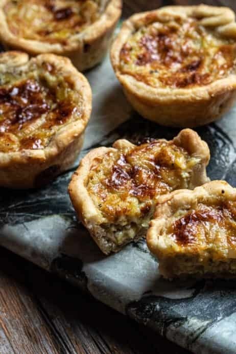 The walnuts are incorporated into the pastry of these savory Stilton and Walnut Tartlets, which are perfect finger-food for your next gathering. You can blind bake the pastry shells up to three days in advance, and store them in an airtight container. By Jackie Botto Savory Tartlets, Tart Recipes Savory, Mini Tartlets, Stilton Cheese, Homemade Appetizer, Creamed Leeks, Pastry Shells, Savory Tart, Cooking For A Crowd