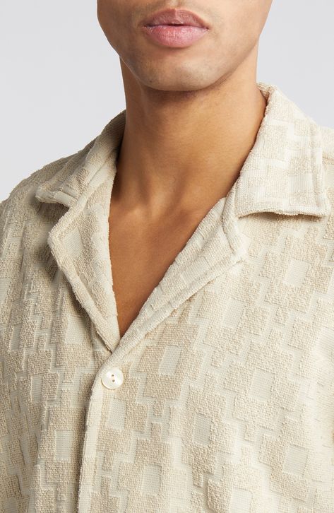 Substantial terry cloth is jacquard knit with a boxy, gridded texture on this camp shirt that's cut in a relaxed fit. 29" length; 44" chest (size Medium) Front button closure Notched collar Short sleeves 100% cotton Machine wash, tumble dry Made in Portugal