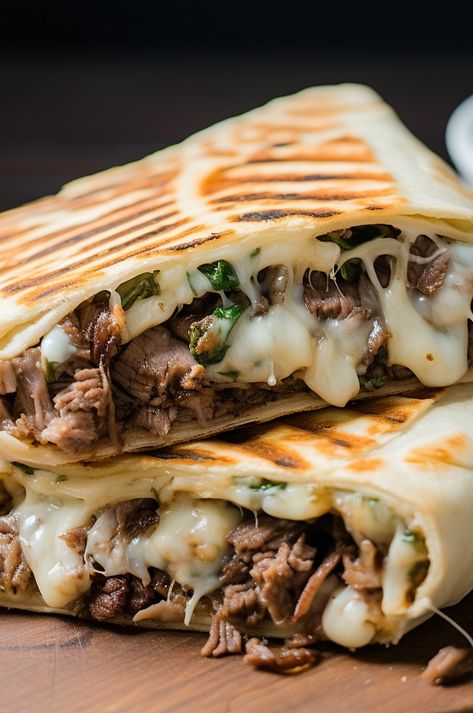 A delicious and easy-to-make grilled wrap filled with all the flavors of a Philly Cheesesteak sandwich. Grilled Tortilla Sandwiches, Philly Cheesesteak Burrito, Keto Philly Cheesesteak Wraps, Cheesesteak Wrap Philly, Philly Cheese Wraps, Philly Steak Wraps Recipes, Cheesesteak Dinner Ideas, Philly Cheese Crunchers, Camping Philly Cheese Steak