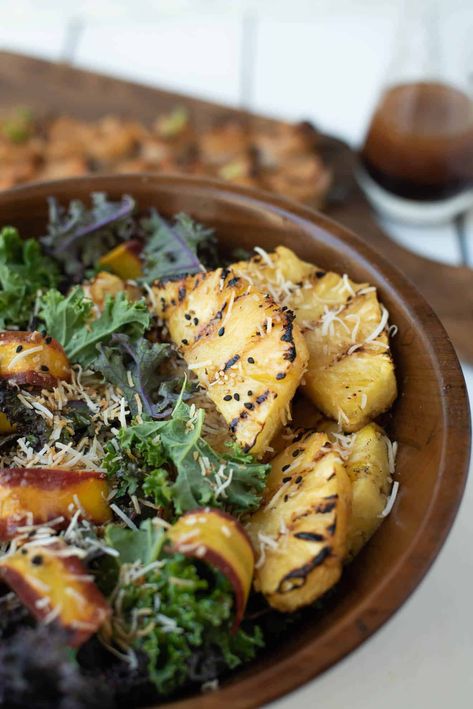 A delicious and fresh tasting Grilled Pineapple, Coconut and Kale Salad that will become your new summer favorite. Served with an Asian inspired dressing with flavors of soy sauce and toasted sesame oil, topped with toasted coconut. #pineapplesalad #kalesalad #vegansalad #pineapplekalesalad Grilled Pineapple Salad, Salad Pineapple, Coconut Kale, Pineapple Salad Recipes, Coconut Salad, Grilled Kale, Toasted Sesame Oil, Pineapple Salad, Coconut Ginger