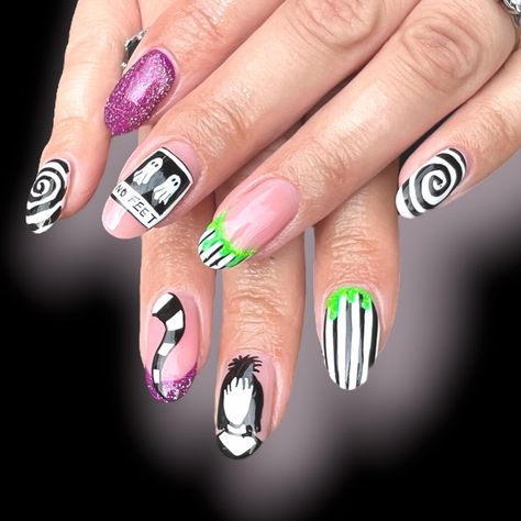 Bring the Madness of Beetlejuice to Your Fingertips with These Themed Press-On Nails! Inspired by the iconic film Beetlejuice, these press-on nails feature bold black and white stripes, ghostly figures, swirling patterns, and splashes of neon green. With a perfect mix of whimsy and spooky, these nails capture the essence of everyone's favourite "bio-exorcist." Whether you're attending a Halloween party or just want to channel your inner trickster, these nails are sure to make a statement. Why Yo Tim Burton Nails, Beetlejuice Nail Art, Beetlejuice Nails, Ongles Design, Holloween Makeup, Spooky Nails, Nails Inspired, Short Almond, Black And White Stripes