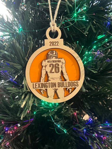 Shop Personalized Football Christmas Ornaments, Wood Ornament with Unique designs, various styles, vibrant colors, and a wide range of sizes. This product is a great idea for a gift Football Christmas Ornaments, Laser Ornaments, Football Ornaments, Wood Football, 2023 Message, Christmas Ornaments Wood, Glowforge Ideas, Ornaments Wood, Football Christmas