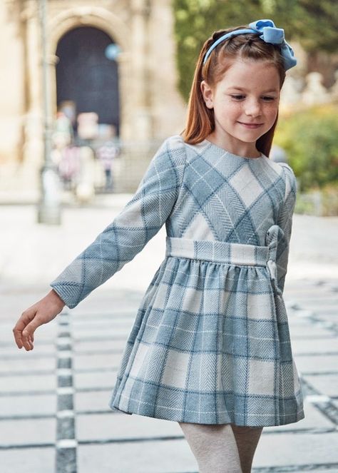 Add a touch of elegance to your little one's wardrobe with this Plaid Dress featuring a chic bow. The classic plaid pattern combined with a stylish bow accent creates a timeless look, perfect for special occasions or holiday gatherings. Crafted from a soft blend of fibers for comfort, it offers a sophisticated yet playful charm. Fully lined for added comfort, ensuring your child feels as good as they look. Fabric Content: Outside: 38% Polyester, 35% Acrylic, 15% Cotton, 10% Wool, 2% Metallic Fib Children Dress Designs, Baby Vintage Clothes, Small Girls Dress, Boy Girl Twin Outfits, Blue Plaid Dress, Children Wear, Smart Dress, Plaid Bow, Bow Dress