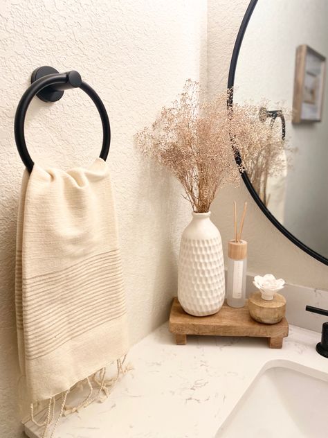 Neutral creamy + wood bathroom decor for spring Neutral Restroom Decor, Small Counter Space Bathroom, Neutral Bathroom Aesthetic, Half Bathroom Decor Minimalist, Toilet Top Decor Ideas, Neutral Apartment Bathroom, Neutral House Aesthetic, Small Townhome Decorating, Modern Organic Bathroom Decor