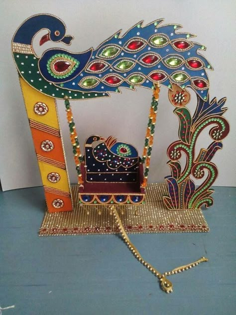 Wowsome.. Krishna Swing  Peacock Design Decoration For Pooja, Jhula Decoration, Krishna Jhula, Diwali Craft Ideas, Kalash Decoration, Kundan Rangoli, Acrylic Rangoli, Thali Decoration Ideas, Thali Decoration