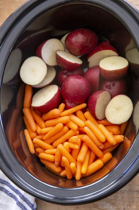 Super easy and so delicious- slow cooker whole chicken with garlic and herbs, potatoes and carrots. The perfect crockpot meal that is our family loves for dinner! It also makes great leftovers. Whole Chicken And Potatoes Crock Pot, Slow Cooker Potatoes And Carrots, Crockpot Whole Chicken And Potatoes, Crockpot Carrots And Potatoes, Carrots And Potatoes Crockpot, Crockpot Potatoes And Carrots, Whole Chicken In The Crockpot, Slow Cooker Whole Chicken, Roasted Potatoes And Carrots