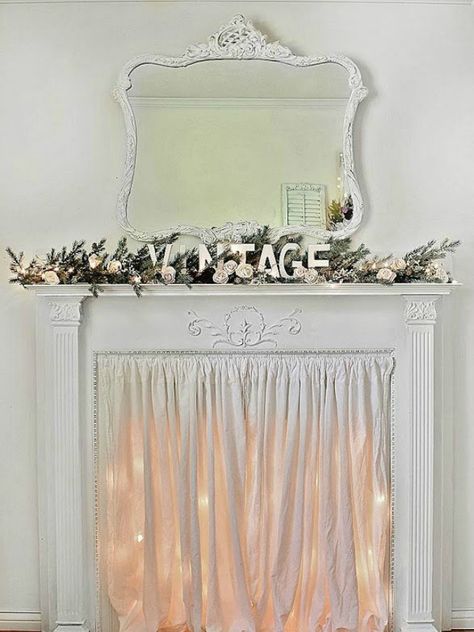 Use twinkle lights and fabric to create a dreamy mock fireplace. Farmhouse Decor Mantle, Vintage Mantle, Farmhouse Mantle, Fake Fireplace, White Fireplace, Faux Fireplace, Shabby Chic Christmas, Shabby Chic Farmhouse, Christmas Mantle