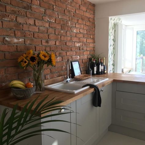 Wren Kitchens on Instagram: “Beautiful exposed brick and a Nora tap creates a statement in this Shaker Ermine kitchen in Pebble Matt ❤️ @renovating_46  #wrenkitchens…” Brick Wall Kitchen Ideas, Red Brick Kitchen, Brick Wall Kitchen, Brick Effect Tiles, Brick Backsplash Kitchen, Brick Wall Wallpaper, Brick Slips, Stone Backsplash Kitchen, Wren Kitchen