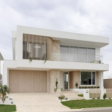 HAAUS.® on Instagram: "What a vibe coming home to this everyday 🙌  Create the Look 🍃Interiors and Product Selections: @haausdesign  🍃Driveway: @ambertiles Premium Classic 100 x 100  🍃Grout: @ardexaustralia WJ50 in White purchased from @ambertiles  🍃Seal: @ambertiles Amber Seal 🍃Driveway Installation: @modern_earth_landscapes  🍃Garage Door Battens: @deco_australia Curly Birch 🍃Garage Door Design and Install: @racgaragedoors  🍃Stone Feature: @veneerstoneaustralia Arctic Travertine Drystacked purchased from @ambertiles  🍃Porch Pavers: @ambertiles Premium Classic 🍃Front Door Handle: @designerdoorware Custom 2.1m Brass Handle 🍃 Curved Battens: @deco_australia Curly Birch (exact spacing will be put on our website) 🍃Aluminium Cladding: @deco_australia Flat White (absolute game change Kizimkazi Zanzibar, Modern Homes Exterior, House Facades Australia, Coastal Home Exterior, Home Front Door, White Exterior Houses, Modern Coastal Home, Aluminium Cladding, Entry Mudroom