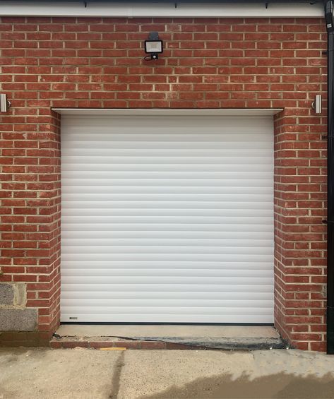 SWS SeceuroGlide Classic Roller Garage Door Finished in White & Installed in Morden By Our New Malden Branch.  If you’re looking to replace your garage door, we supply & fit all types including both retractable & canopy up & over garage doors. Call 0800 716 569 to speak with one of our experts or alternatively, visit www.accessgaragedoors.com to book a free survey. #AccessGD #SeceuroGlide #RollerGarageDoor #Morden Garage Door White, Grunge Garage, University Of Michigan Wolverines, Garage Door Installation, Graphic Shirt Design, Retractable Canopy, Liquor Store, Michigan Wolverines, Garage Door