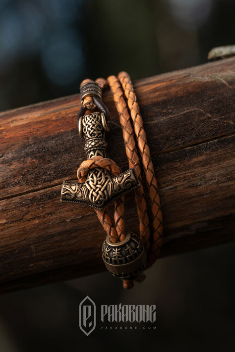 Elevate your style with our Viking bracelet featuring Thor's Hammer and Odin's Ravens. Crafted from high-quality Italian Bronze PANDORA, it offers durability and elegance. Our Norse jewelry prioritizes health, free from harmful metals like Lead or Nickel. Inspired by historical designs, this bracelet blends authenticity with modern style, perfect for daily wear. #VikingJewelry #ThorBracelet #NorseAccessories Viking Arm Rings, Viking Aesthetic, Nordic Jewelry, Viking Jewellery, Thor's Hammer Mjolnir, Odin's Ravens, Hammered Bracelet, Norse Jewelry, Ancient Vikings