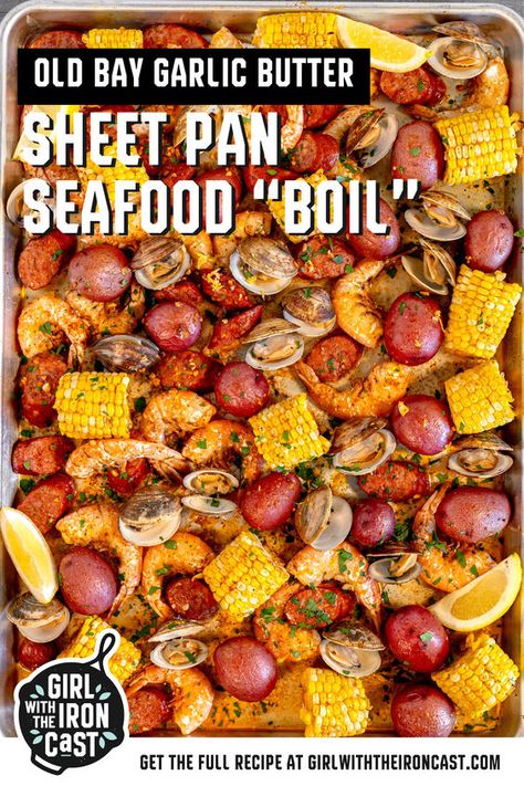 Nothing captures the essence of summer like a clambake or seafood boil! This recipe simplifies the process by roasting juicy shrimp, briny clams, spicy andouille sausage, corn on the cob, and baby potatoes, tossed in an Old Bay butter sauce on a sheet pan in the oven. Serve family style, start peeling, and enjoy a tender, succulent seafood dinner. Seafood Broil In Oven, Pan Seafood Boil, Shrimp Boil In Oven, Seafood Cuisine, Seafood Broil, Seafood Boils, Boil Recipes, Taco Side Dishes, Shrimp Boil Recipe