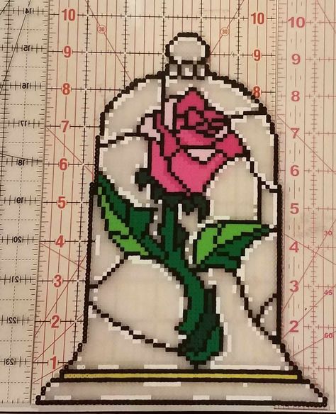 Beauty & the Beast's Enchanted Rose made out of perler beads. Beauty And The Beast Pixel Art, Beauty And The Beast Perler, Beauty And The Beast Perler Beads, Beauty And The Beast Fuse Beads, Tinker Bell Perler Beads, Sleeping Beauty Perler Beads, Beauty And The Beast Perler Bead Pattern, Hercules Perler Beads, Perler Creations