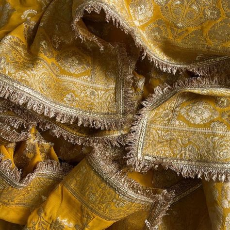 Introducing our Bridal Mustard Regal Fringed Dupatta, a magnificent blend of traditional elegance and modern artistry. This stunning dupatta, in a rich and vibrant Yellow hue, is crafted to perfection, making it an ideal accessory for special occasions and festive celebrations. The highlight of this dupatta is the exquisite Banarsi border, which adds a touch of regal charm and sophistication. The border is intricately designed, featuring delicate patterns that enhance the overall appeal of the p Bridal Dupatta Designs, Lehenga Chunni, Banarsi Dupatta, Asian Attire, Dupatta Designs, Bridal Dupatta, Desi Fashion Casual, Boutique Dress Designs, Indian Designer Outfits