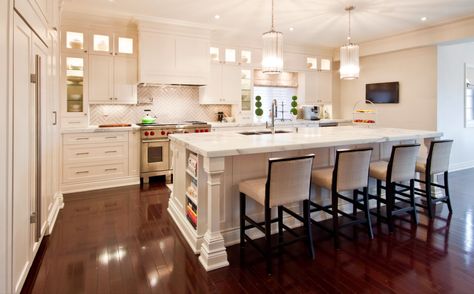 Large kitchen island with bookshelf at end of island and light tall cabinets Kitchen Island With Bookshelf, Island With Bookshelf, Kitchen Transitional, Kitchen Island Bar, Herringbone Backsplash, Kitchen Backsplash Designs, Stools For Kitchen Island, White Kitchen Design, Transitional Kitchen